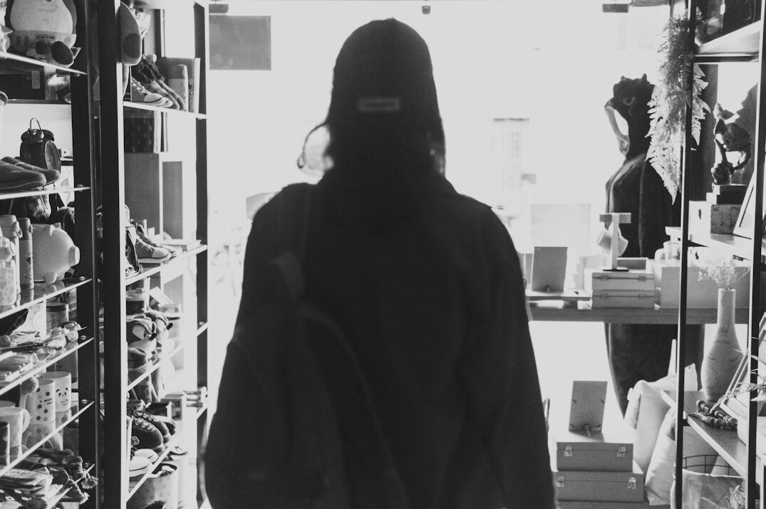 store detective catching thief