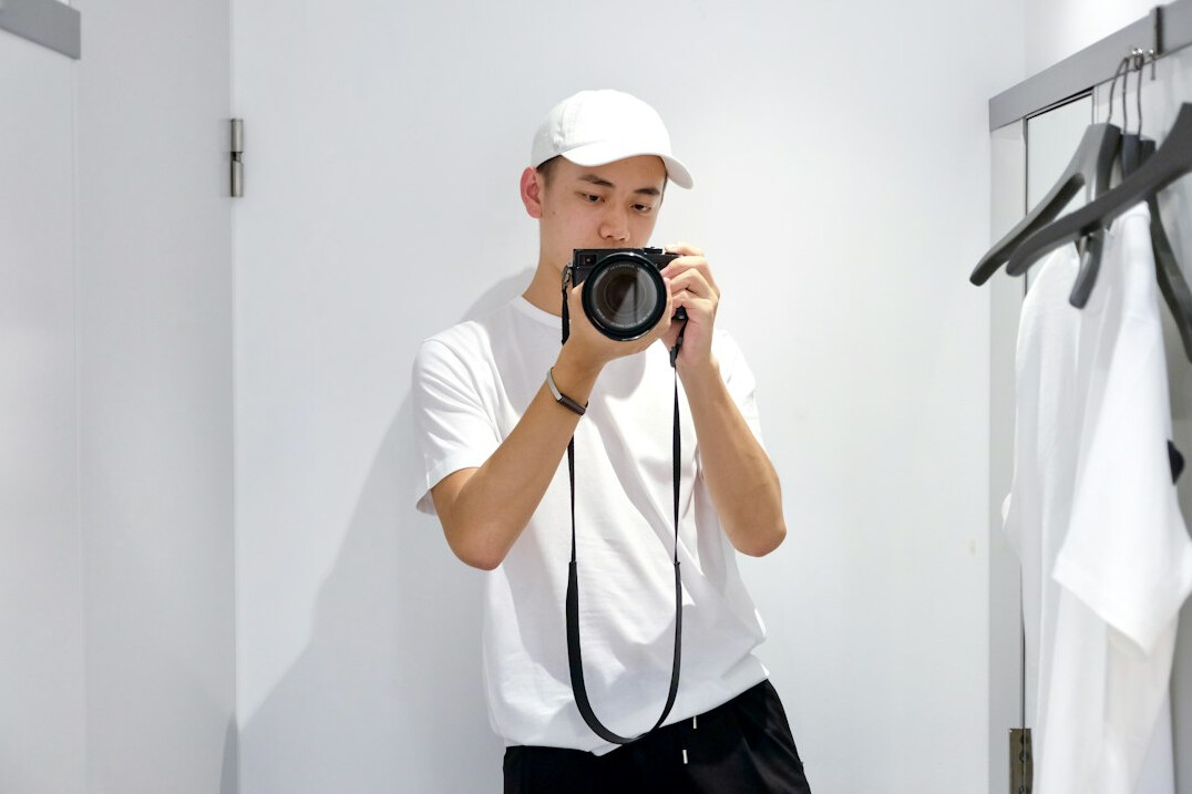 thief trying on clothes in fitting room