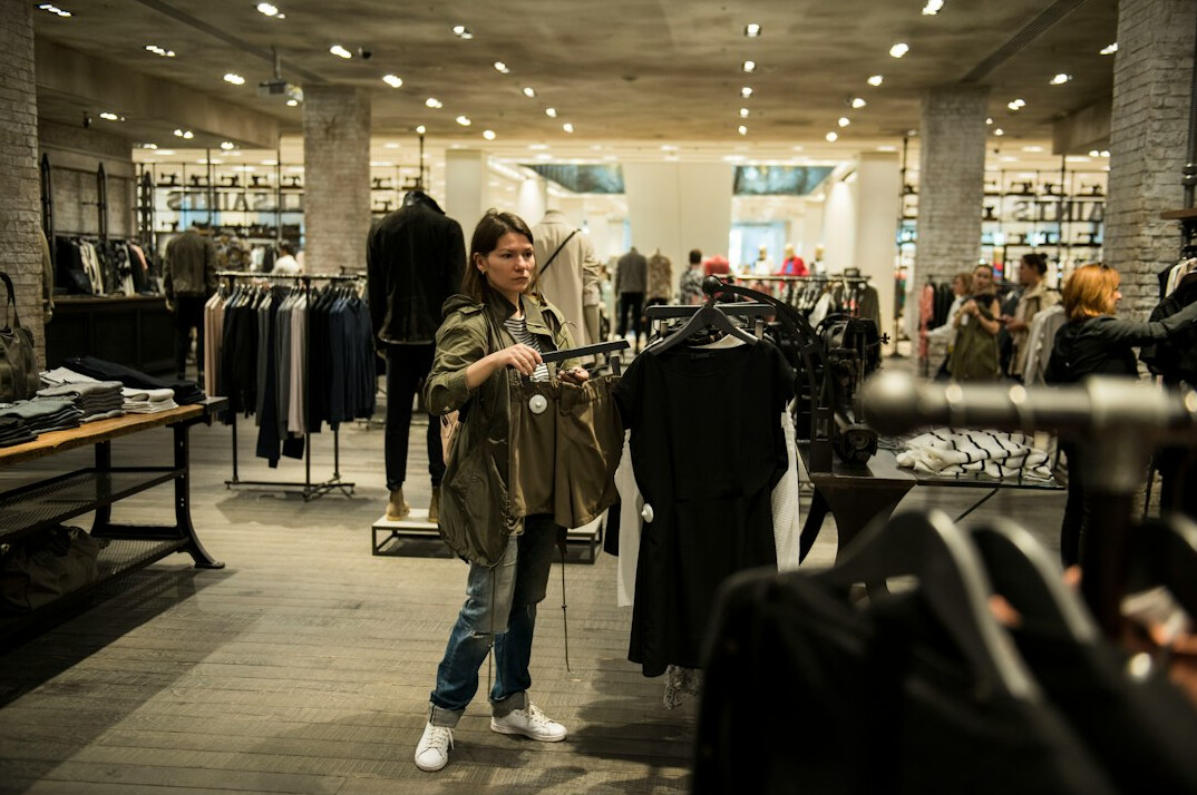 store detective watching shoppers