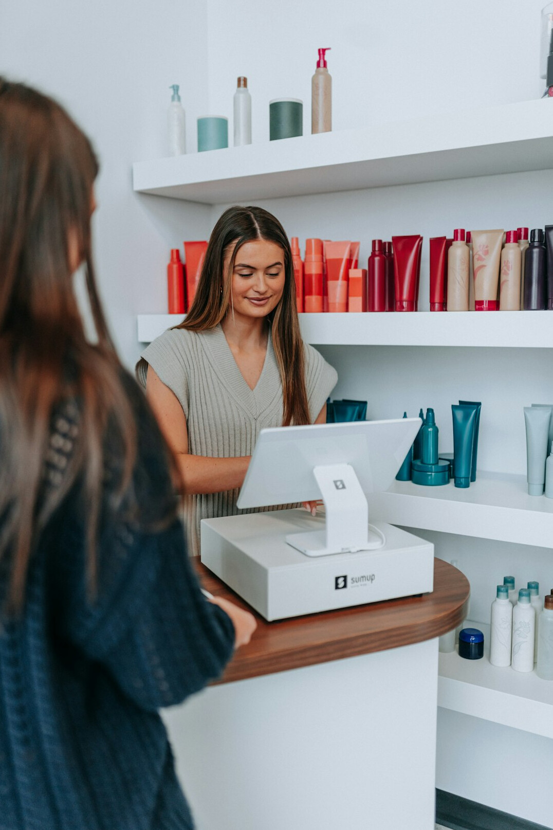 woman returning item at store counter